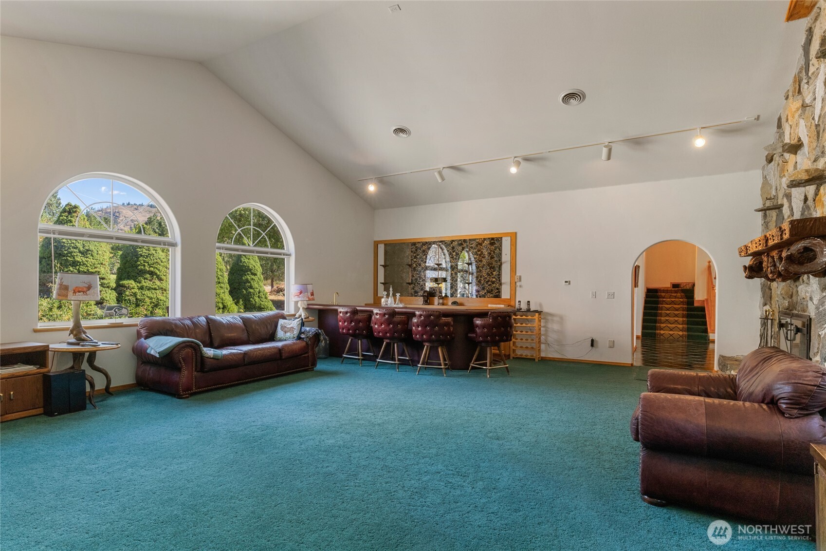 572 B W Chewuch Road Winthrop, WA 98862 - Photo 11 of 37 a living room with furniture and a large window