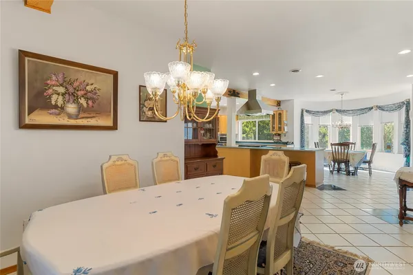a kitchen with stainless steel appliances kitchen island granite countertop a sink and cabinets