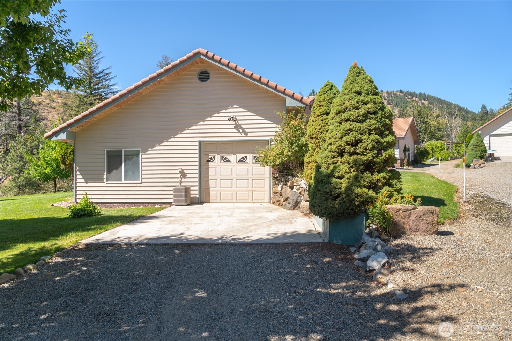 572 B W Chewuch Road Winthrop, WA 98862 - Photo 34 of 37 a front view of a house with garden