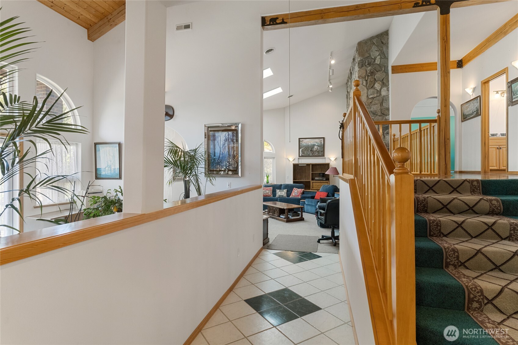 572 B W Chewuch Road Winthrop, WA 98862 - Photo 10 of 37 a view of a hallway to a large window with wooden floor