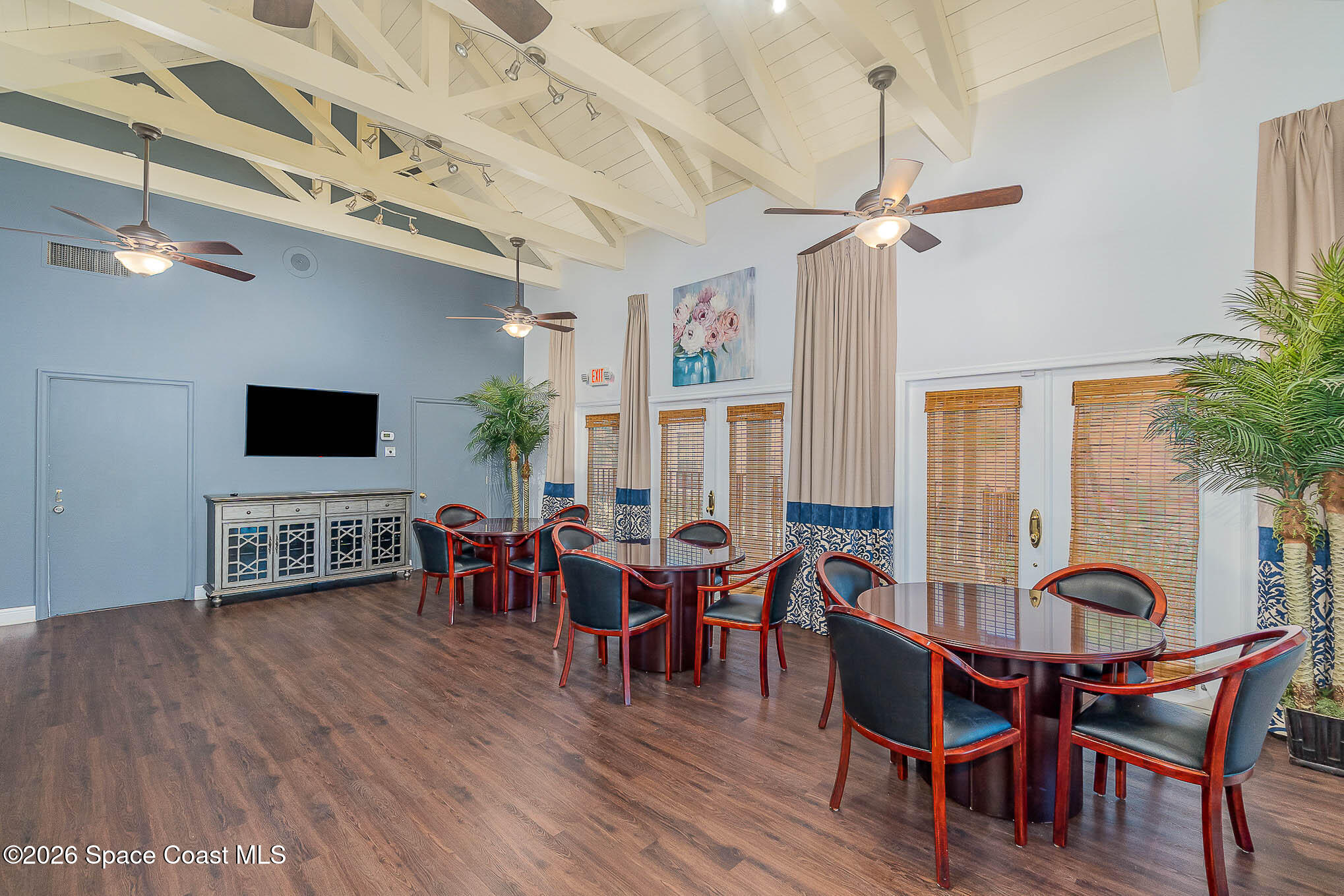 7667 North Wickham Road, Unit 818 Melbourne, FL 32940 - Photo 28 of 29 a view of a dining room with furniture window and wooden floor