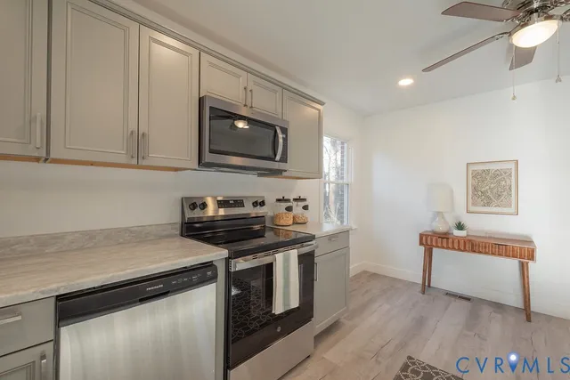a view of a bathroom with a toilet sink and a window