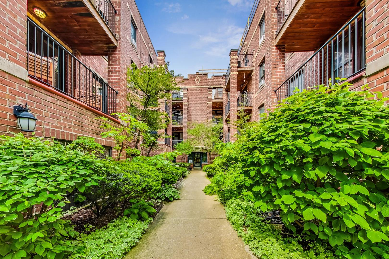 2108 North Seminary Avenue, Unit 5 Chicago, IL 60614 - Photo 1 of 16 a view of a pathway both side of house