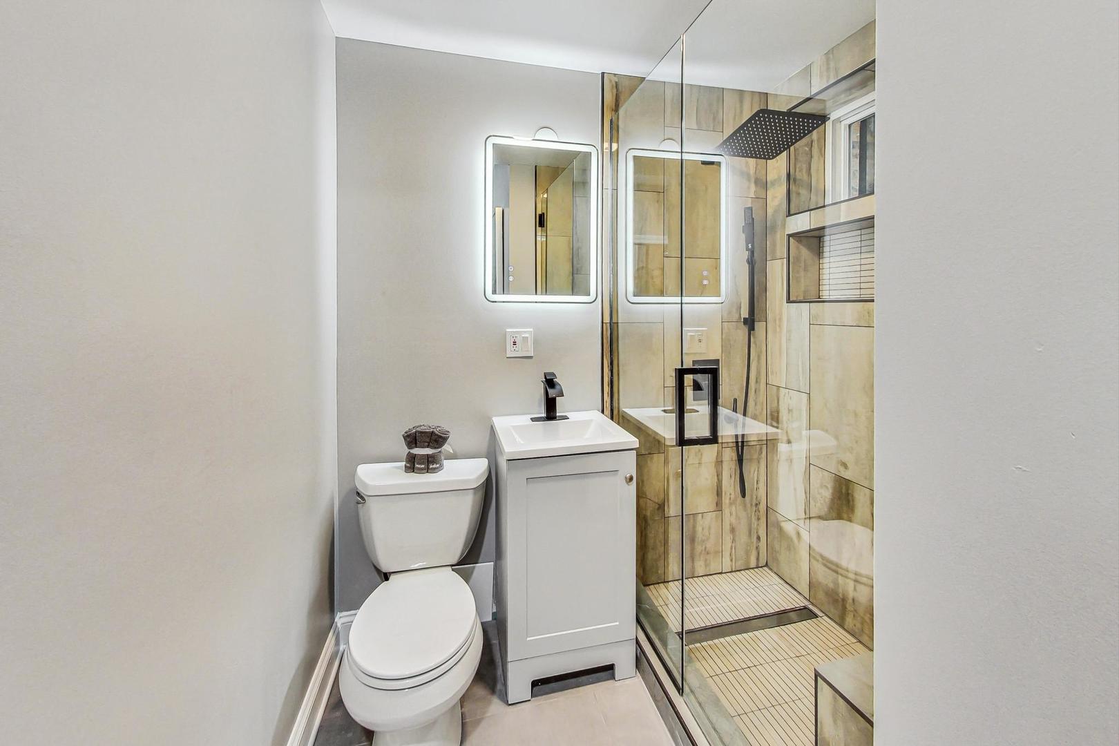 2108 North Seminary Avenue, Unit 5 Chicago, IL 60614 - Photo 13 of 16 a bathroom with a toilet a sink and shower