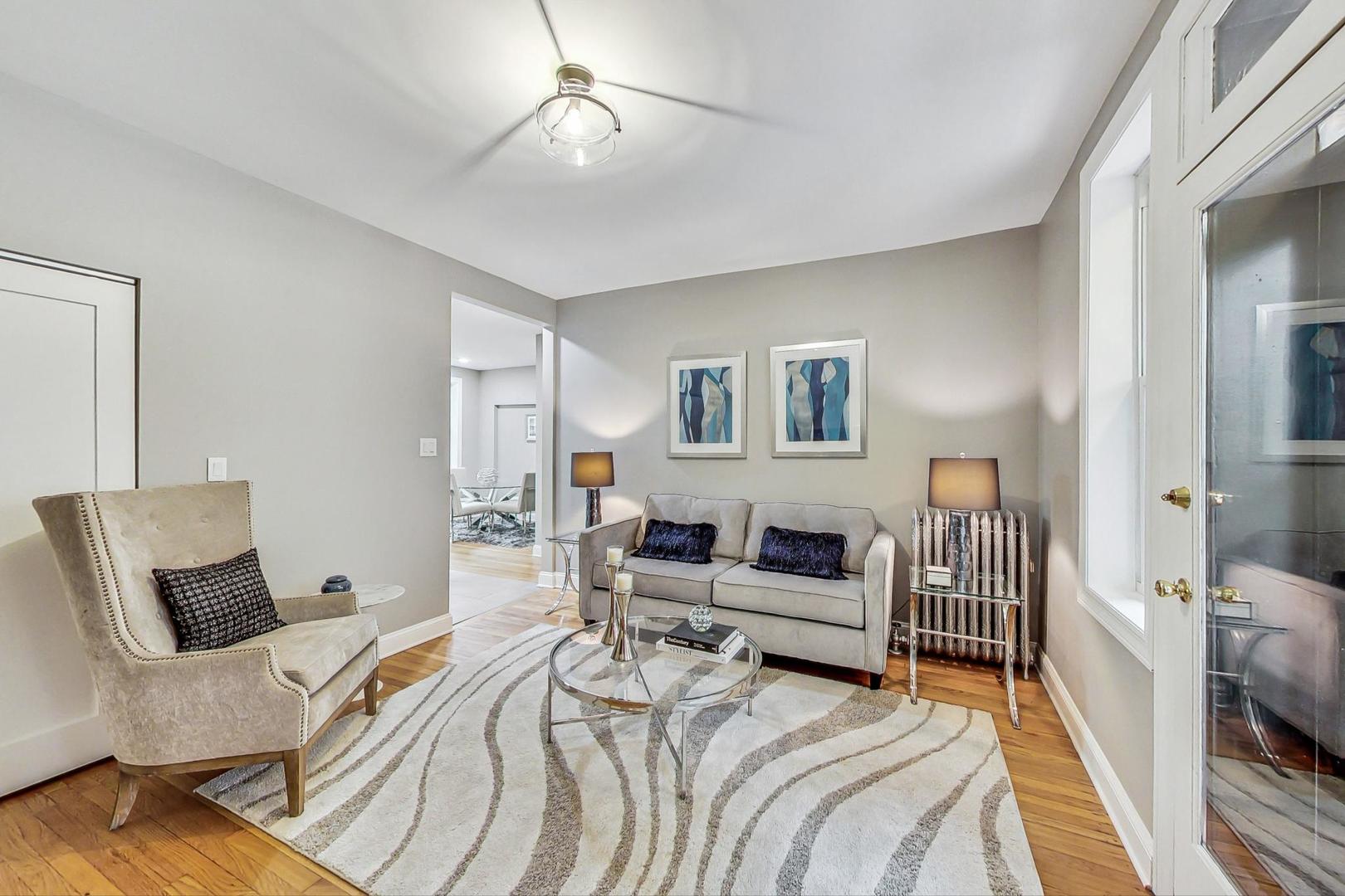 2108 North Seminary Avenue, Unit 5 Chicago, IL 60614 - Photo 4 of 16 a bedroom with furniture and a wooden floor