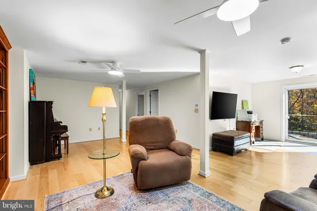 a bedroom with a bed and a potted plant
