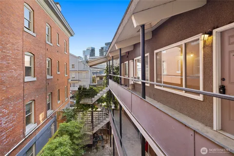 a balcony with view of an outdoor seating