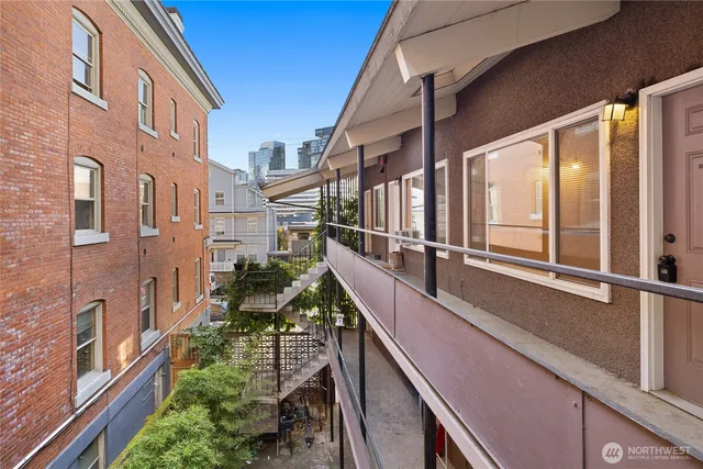 a balcony with view of an outdoor seating