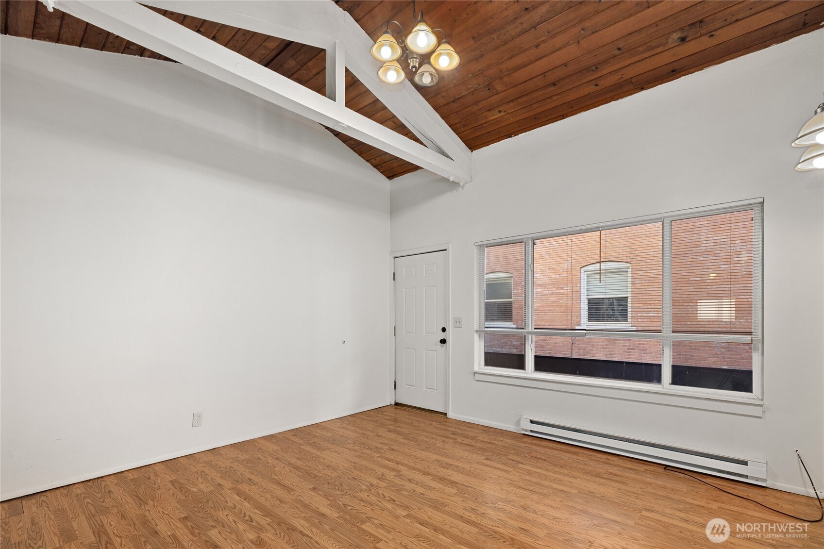 1718 Summit Avenue Seattle, WA 98122 - Photo 4 of 11 a view of an empty room with a window