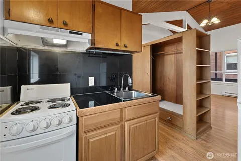 a kitchen with stainless steel appliances granite countertop a stove and a refrigerator