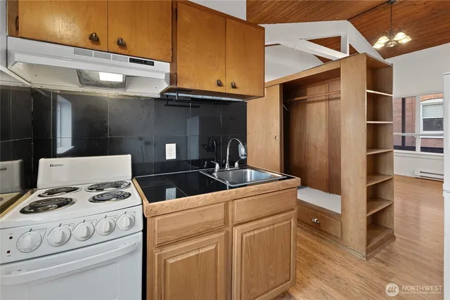 a kitchen with stainless steel appliances granite countertop a stove and a refrigerator
