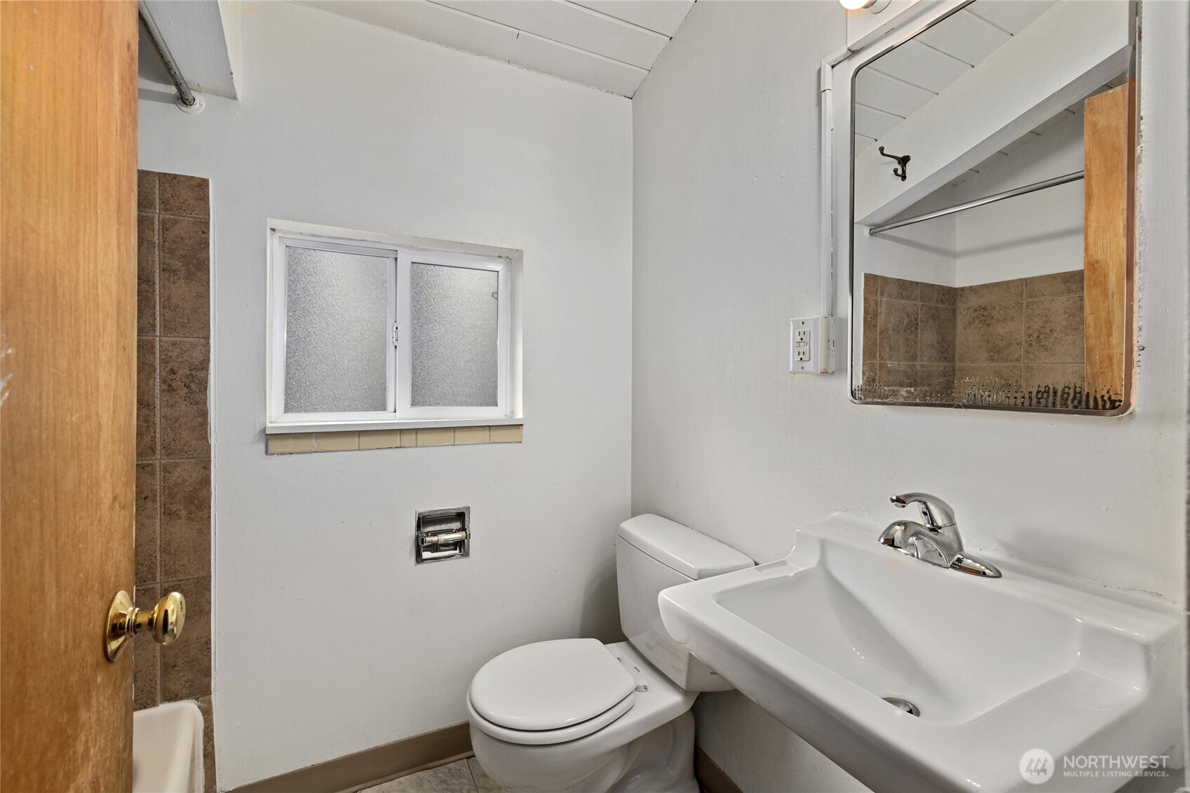 1718 Summit Avenue Seattle, WA 98122 - Photo 8 of 11 a bathroom with a sink mirror and toilet