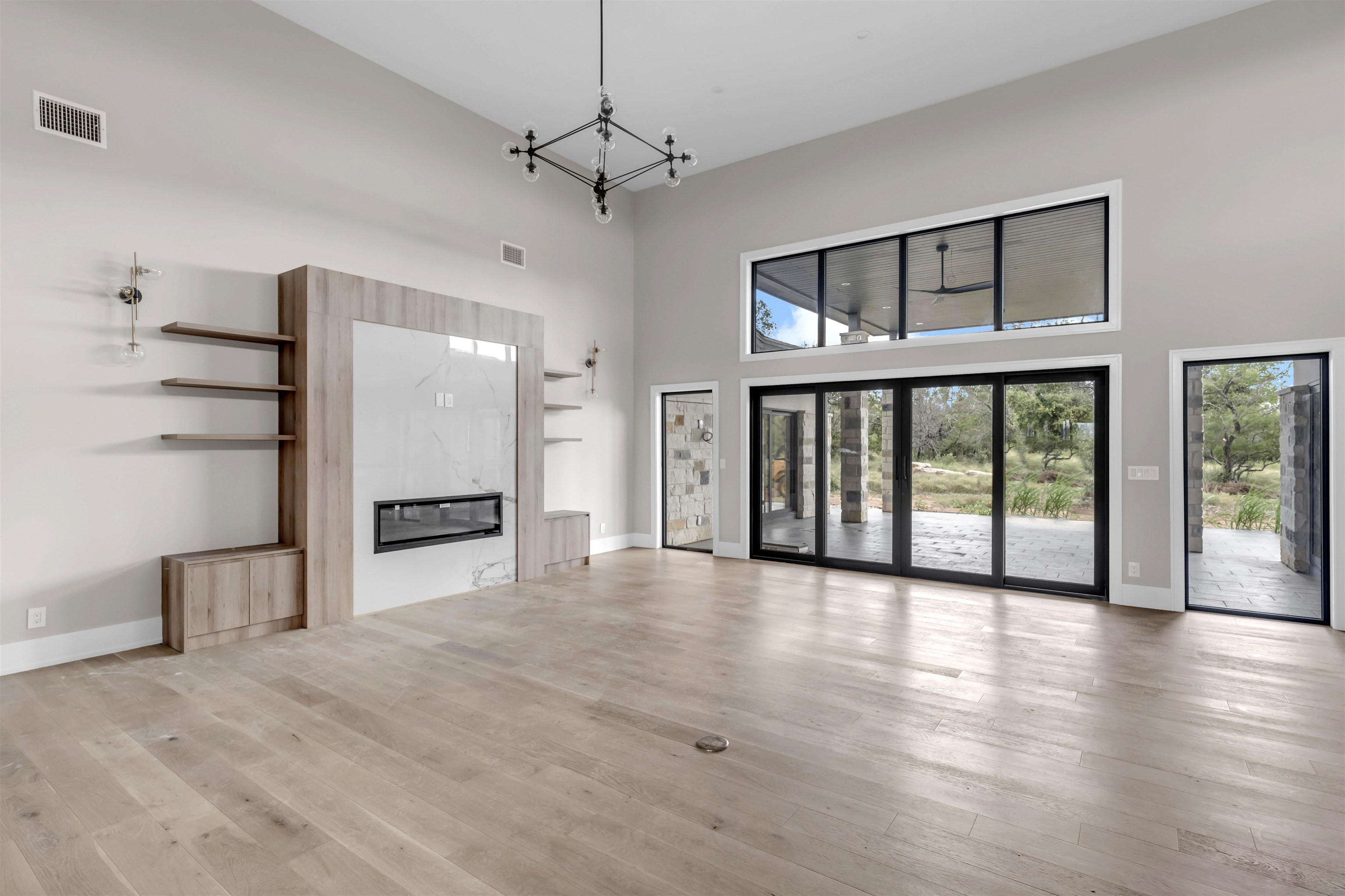 6507 Ranch Road 962 West Round Mountain, TX 78663 - Photo 12 of 28 a view of a big room with windows and entryway