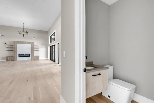 a white toilet sitting next to a bathroom sink