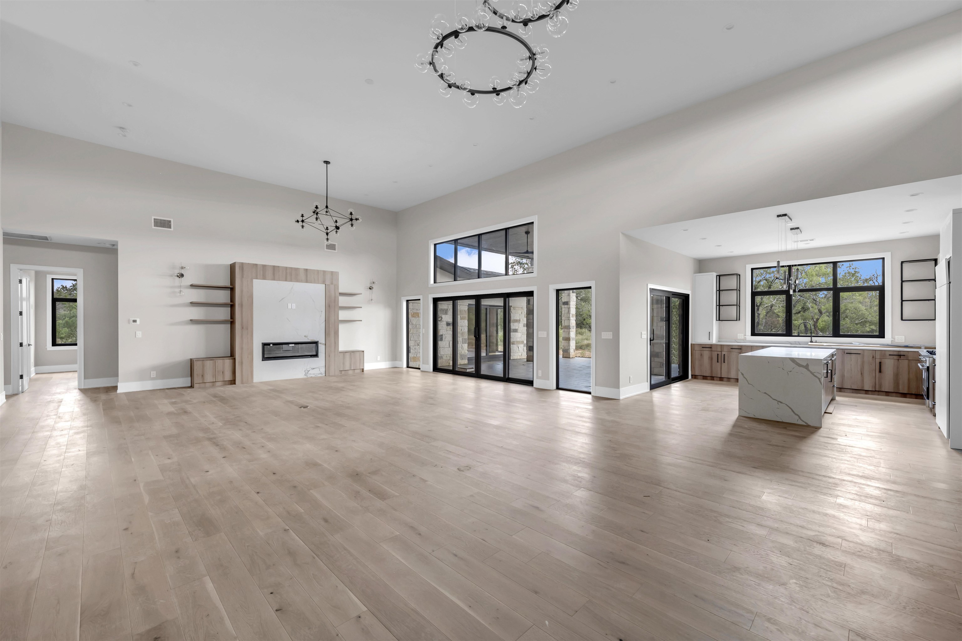 6507 Ranch Road 962 West Round Mountain, TX 78663 - Photo 14 of 28 a view of an empty room with wooden floor and a window