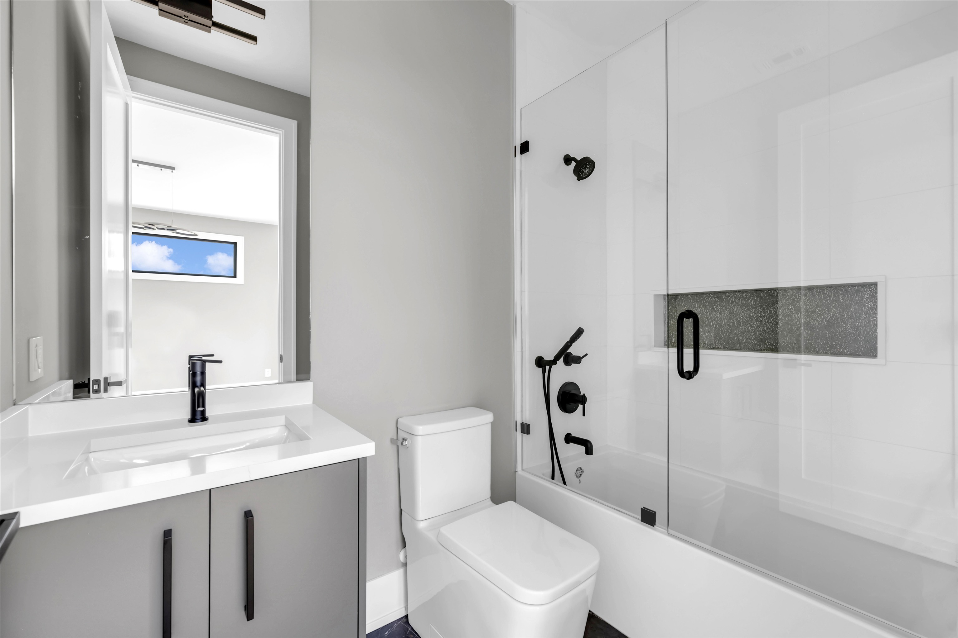 6507 Ranch Road 962 West Round Mountain, TX 78663 - Photo 21 of 28 a bathroom with a sink a toilet and shower