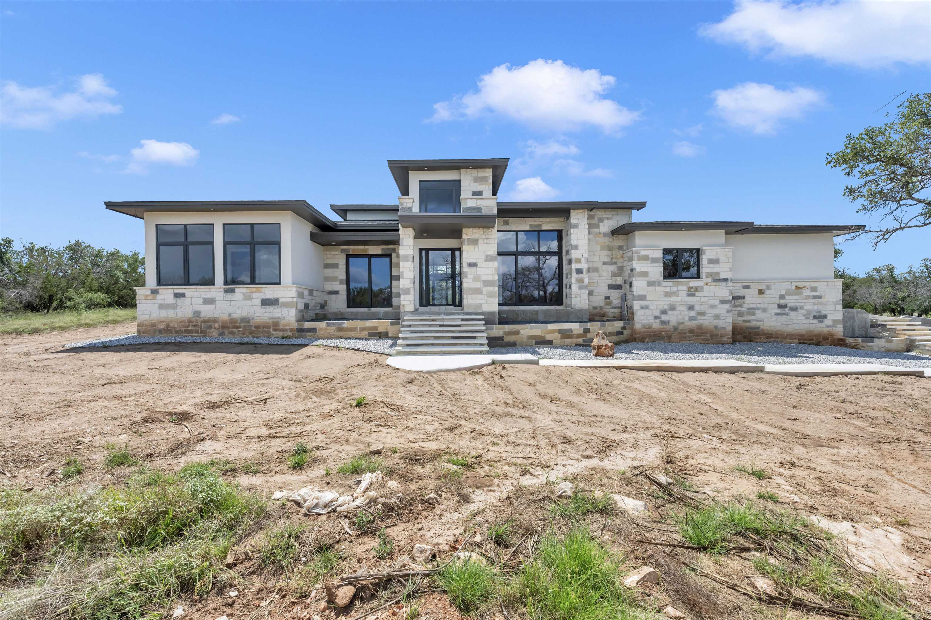 6507 Ranch Road 962 West Round Mountain, TX 78663 - Photo 4 of 28 a view of a house with a yard