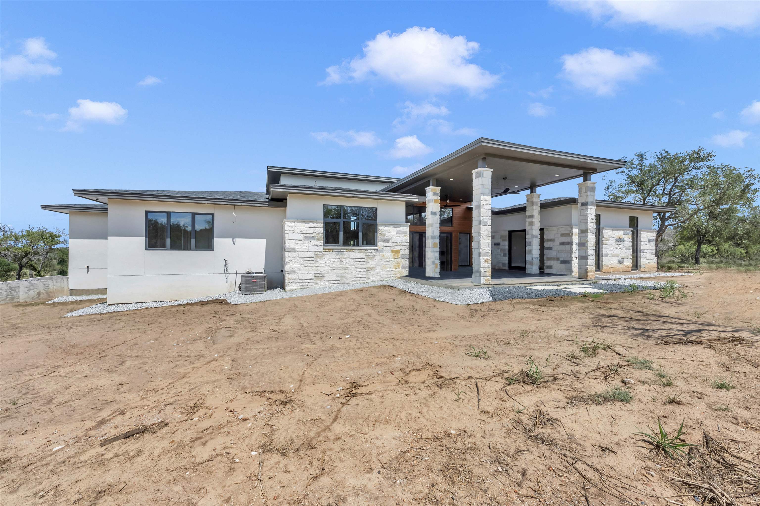 6507 Ranch Road 962 West Round Mountain, TX 78663 - Photo 7 of 28 a view of a house with a yard