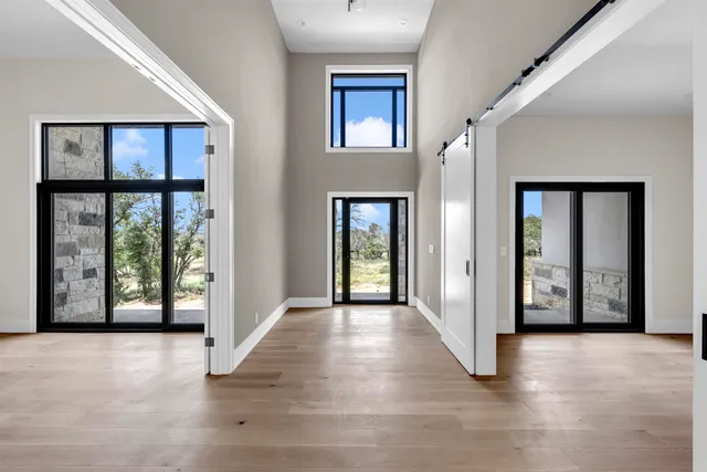 a view of an entryway with wooden floor