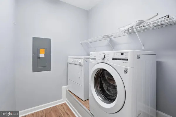 a view of a storage & utility room with a washer dryer
