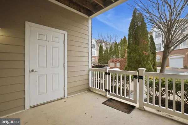 a view of a house with a wooden fence
