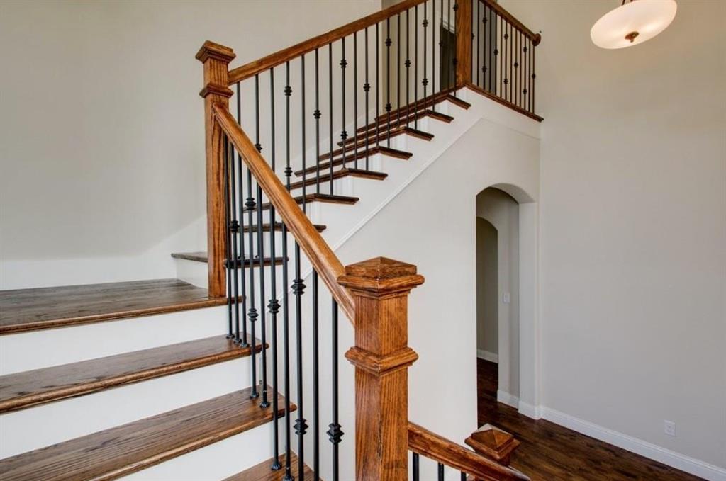 421 Prairie Run Aledo, TX 76008 - Photo 18 of 19 Stairway with wood finished floors and arched walkways