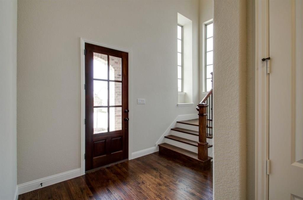 421 Prairie Run Aledo, TX 76008 - Photo 9 of 19 Entryway with plenty of natural light, dark wood-style floors, and stairway
