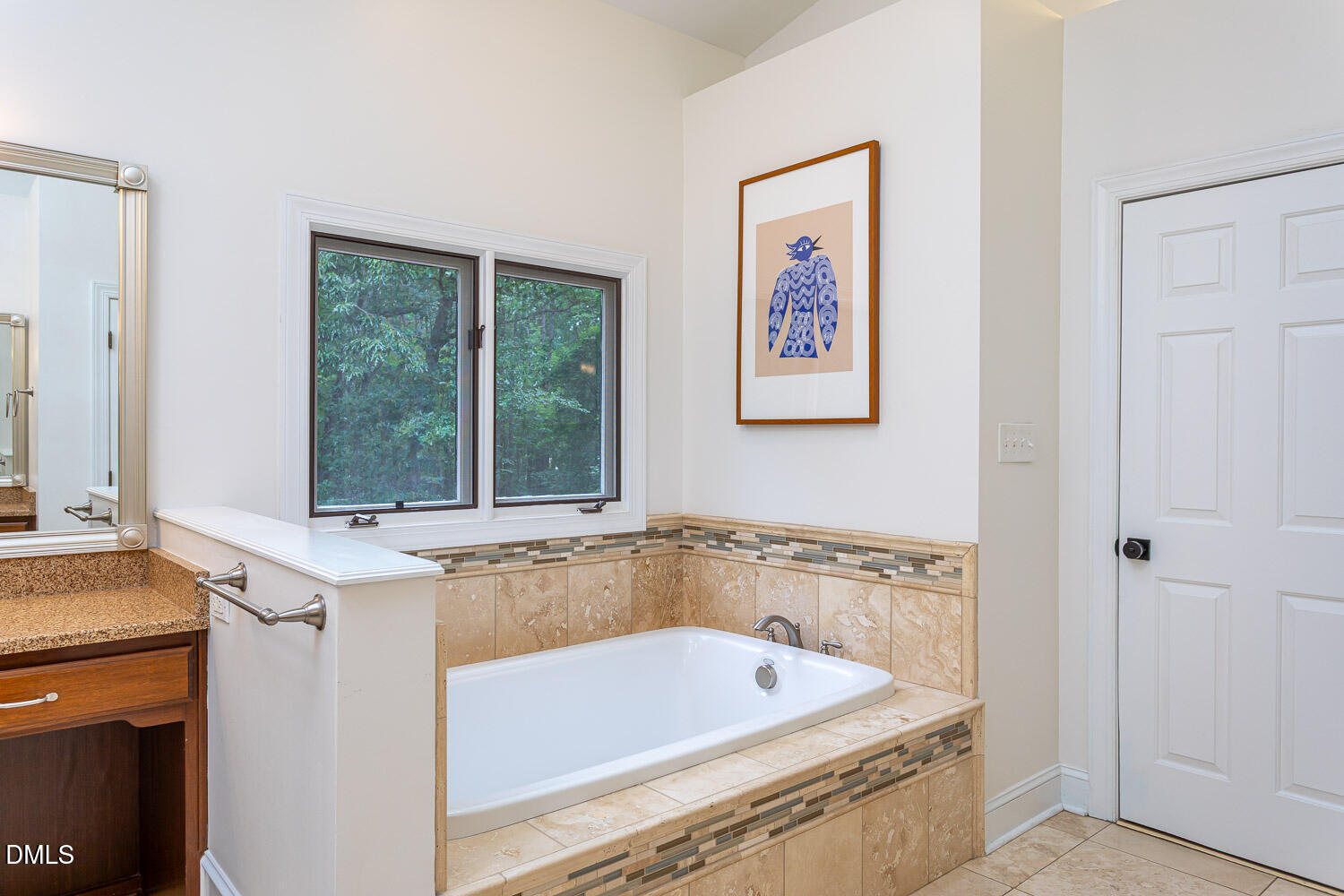 8509 Towneley Place Raleigh, NC 27615 - Photo 21 of 36 a bathroom with a tub a sink and a window