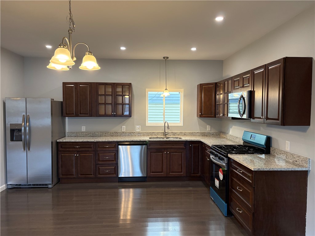 184 Avenue C, Unit M2 Woonsocket, RI 02895 - Photo 2 of 11 Beautiful kitchen featuring granite countertops and stainless steel appliances.