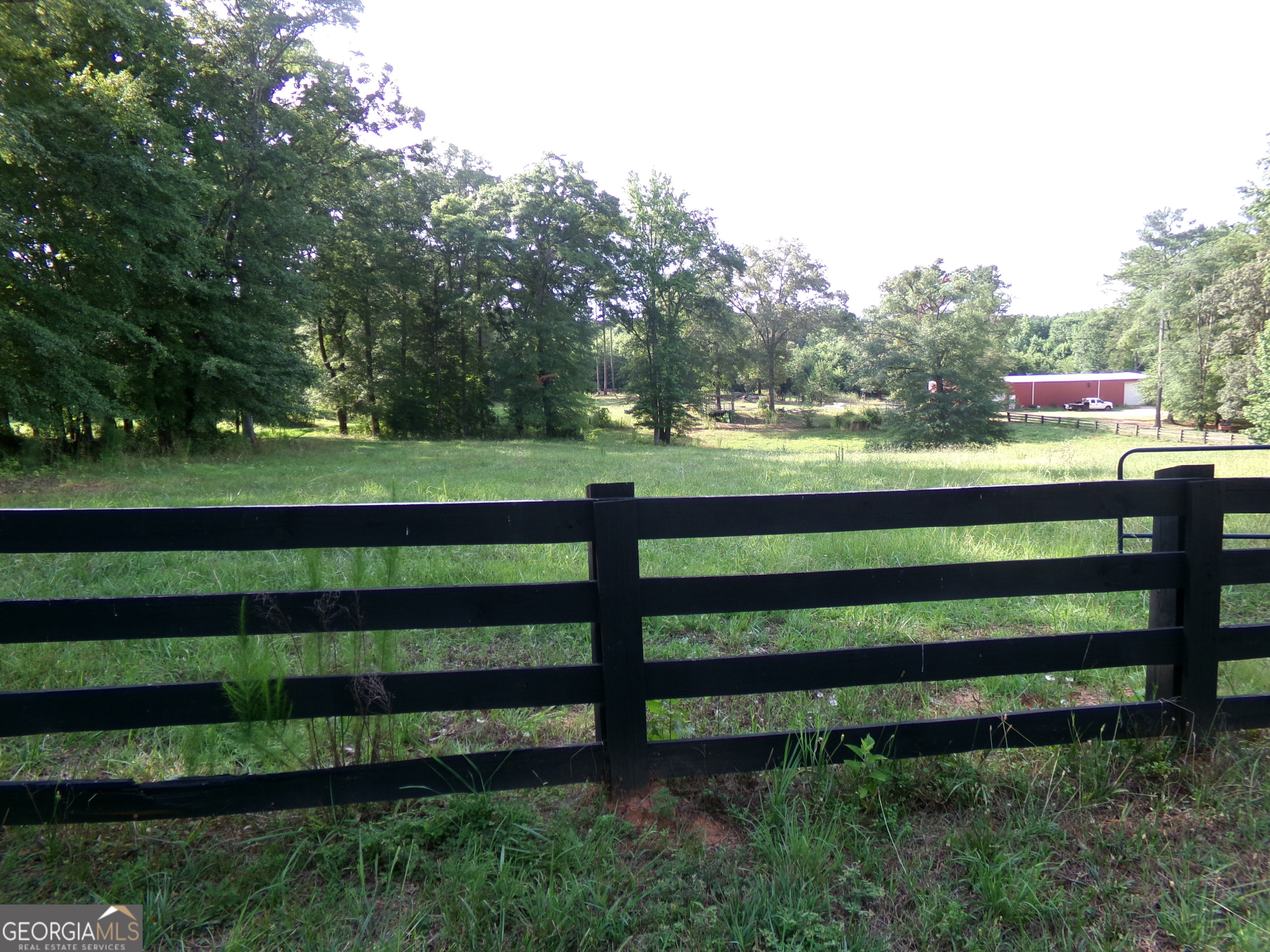 35-acres Youth Jersey Road Covington, GA 30014 - Photo 12 of 42 a view of a wooden deck and bench in the garden
