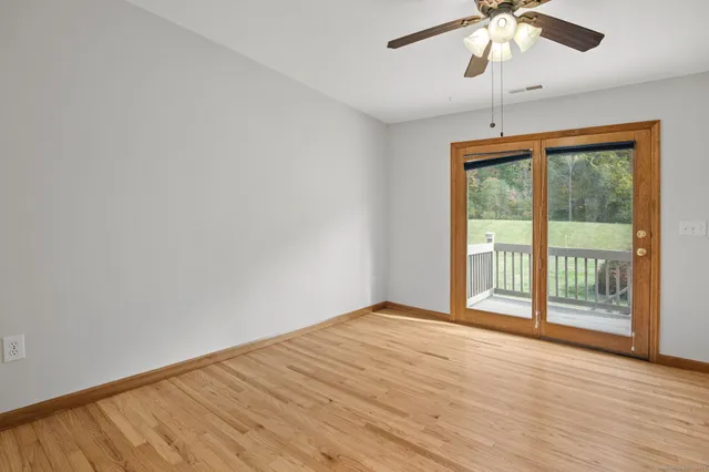 a kitchen with stainless steel appliances granite countertop a stove top oven a sink and a refrigerator