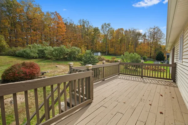 a view of a balcony with wooden floor