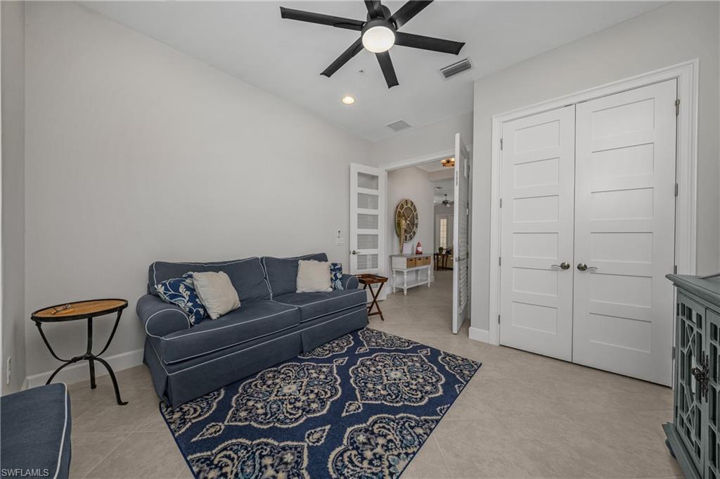 6552 Dominica Drive, Unit 101 Naples, FL 34113 - Photo 23 of 50 a living room with furniture and a rug
