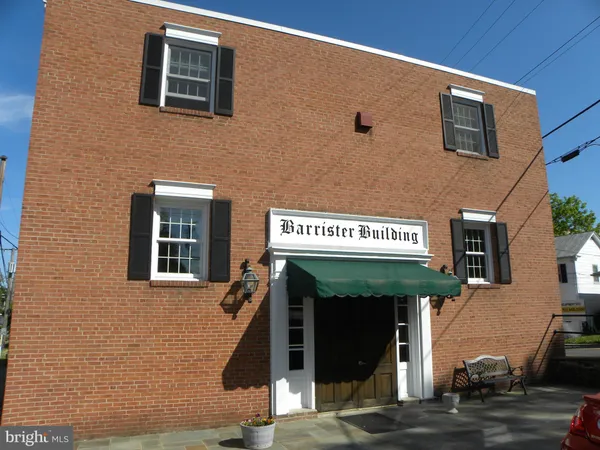 a view of a brick building with many windows