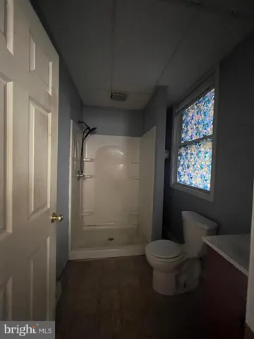 a kitchen with stainless steel appliances a refrigerator sink and cabinets