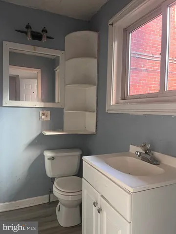 a view of a porch with a table and chairs
