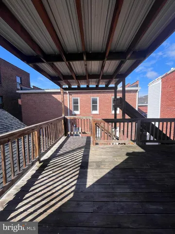 a view of a big room with wooden walls