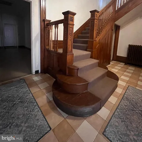 a living room with furniture and a rug