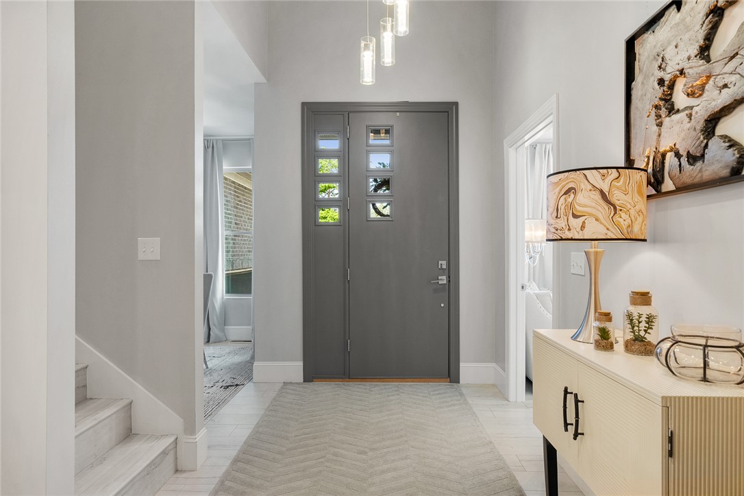 140 Turnberry Road Anderson, SC 29621 - Photo 4 of 44 This entry welcomes with clean lines and contemporary lighting, offering a refined first impression.