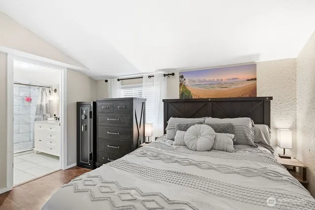 a bedroom with a bed and walk in closet