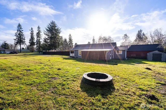 a view of a swimming pool and a yard