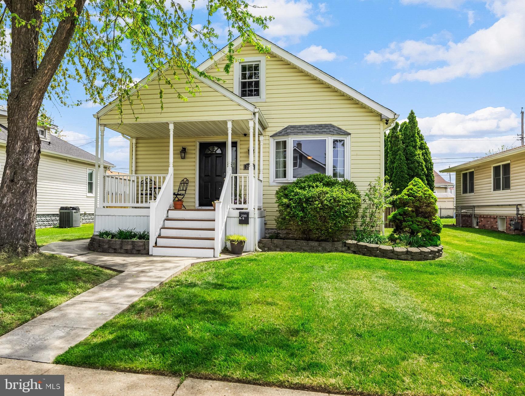 2913 Ritchie Avenue Baltimore, MD 21219 - Photo 1 of 34 a view of a house with a small yard and plants