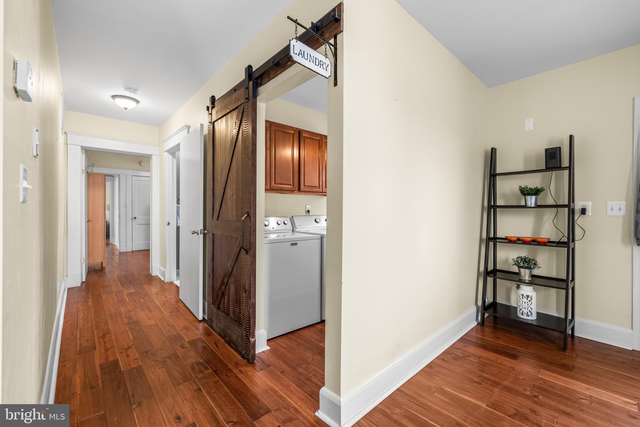 2913 Ritchie Avenue Baltimore, MD 21219 - Photo 12 of 34 a view of a hallway with wooden floor and entryway