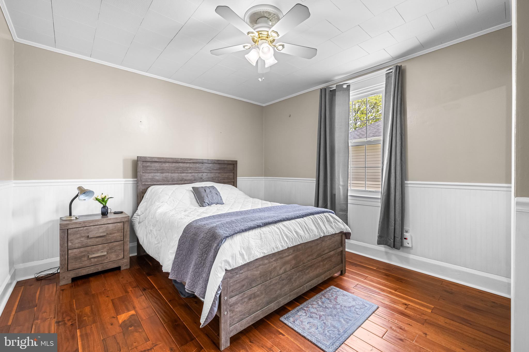 2913 Ritchie Avenue Baltimore, MD 21219 - Photo 17 of 34 a bedroom with a bed and window