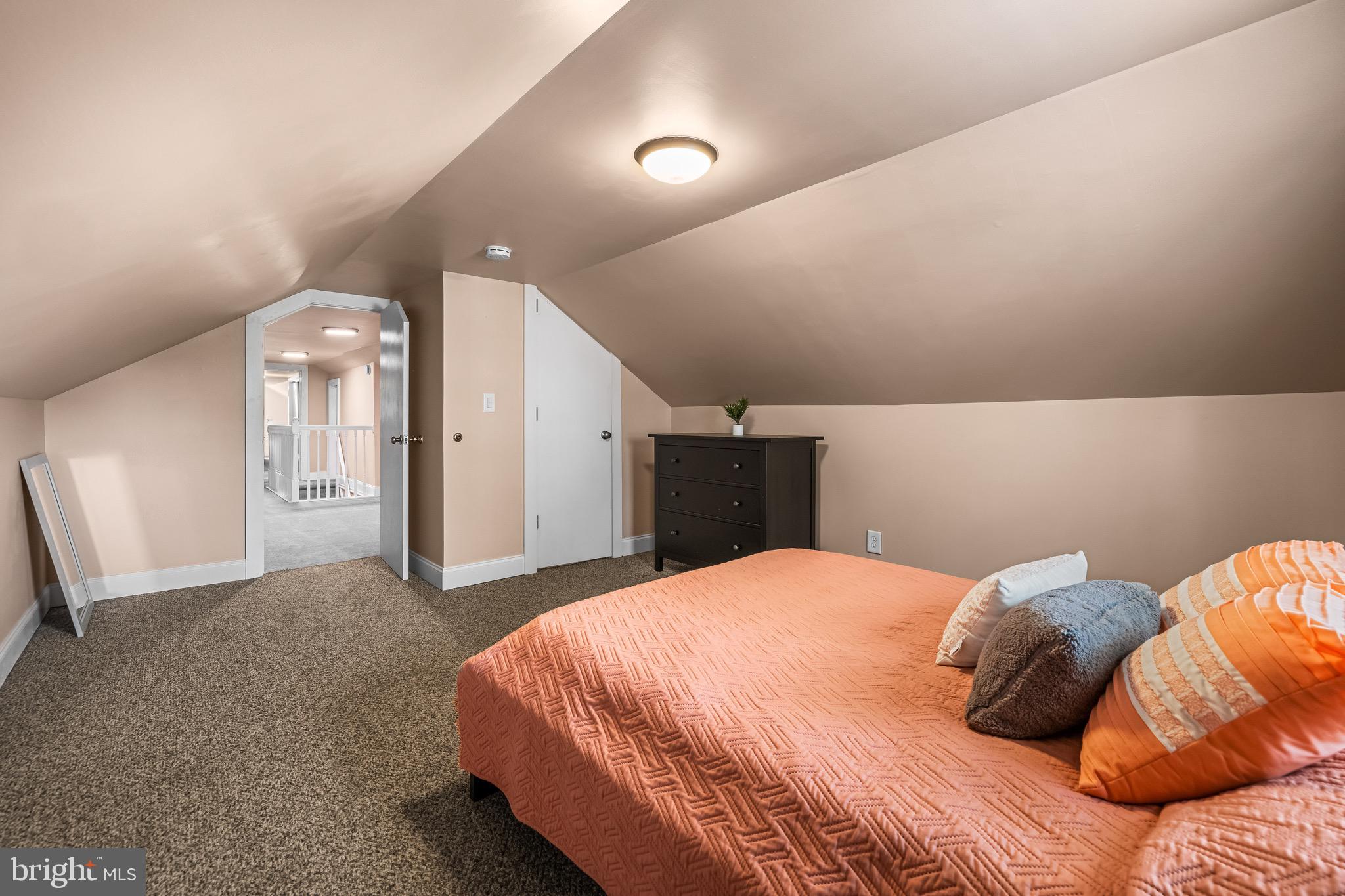 2913 Ritchie Avenue Baltimore, MD 21219 - Photo 25 of 34 a bedroom with a bed and a night stand