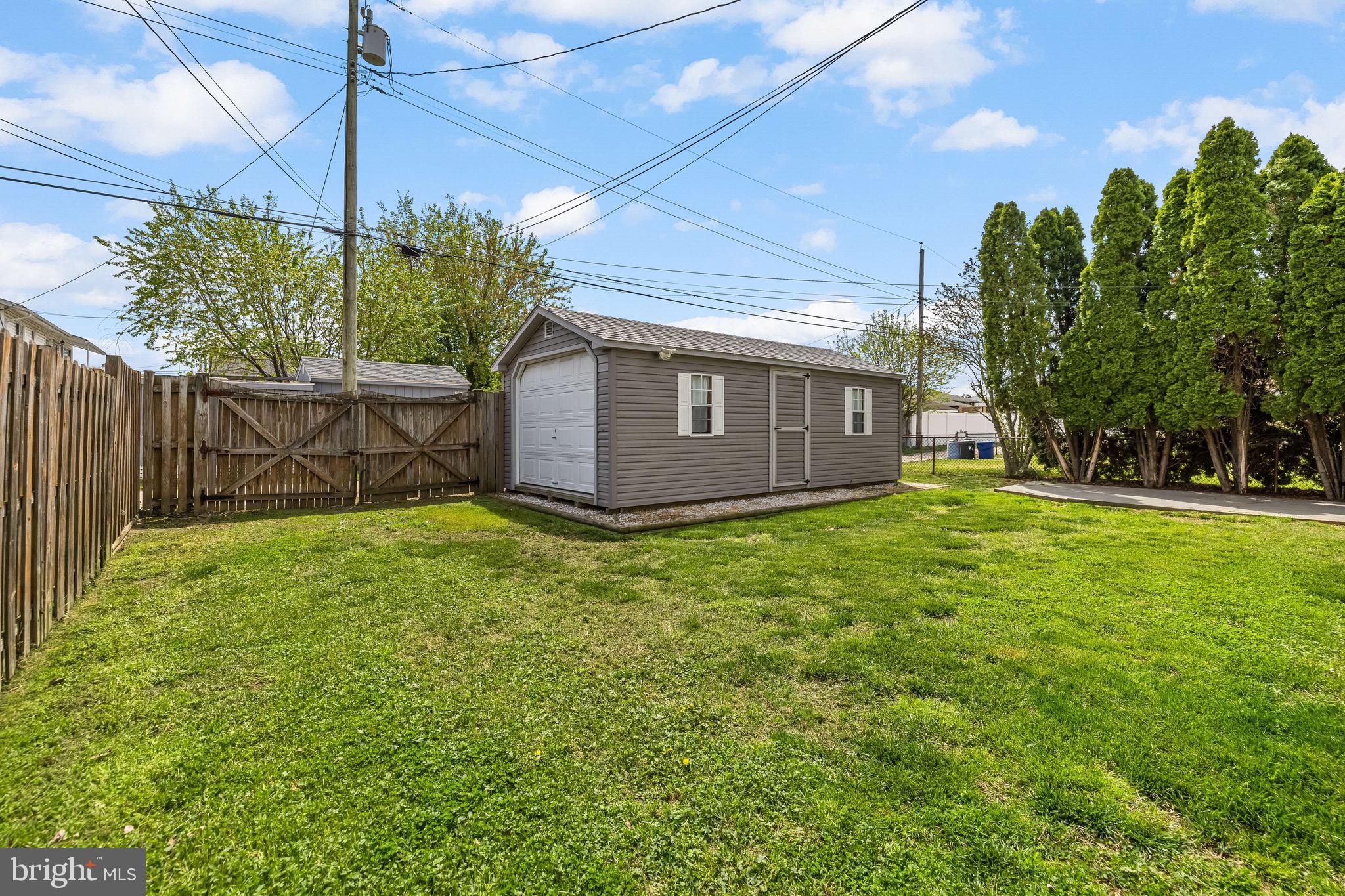 2913 Ritchie Avenue Baltimore, MD 21219 - Photo 30 of 34 a view of a house with a small yard and a garden