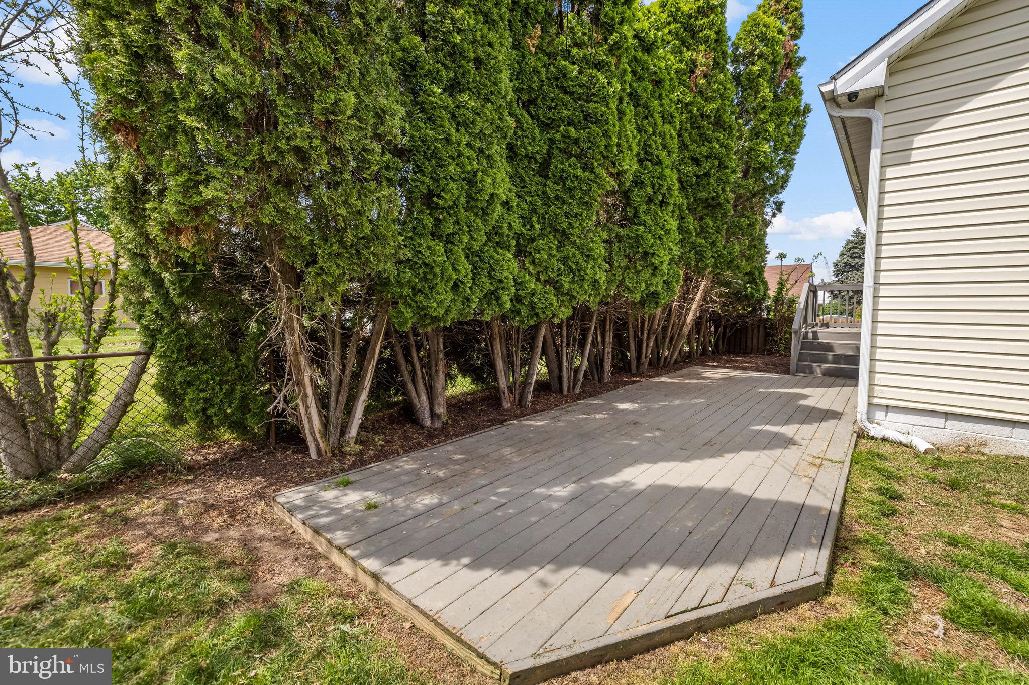 2913 Ritchie Avenue Baltimore, MD 21219 - Photo 33 of 34 a view of a backyard with plants and large trees