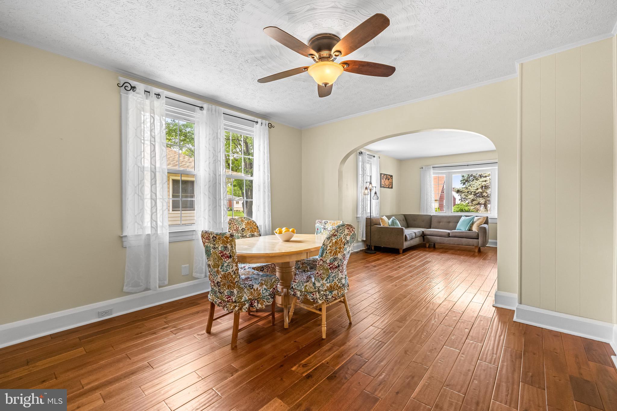 2913 Ritchie Avenue Baltimore, MD 21219 - Photo 7 of 34 a view of a livingroom with furniture and a dining table with wooden floor