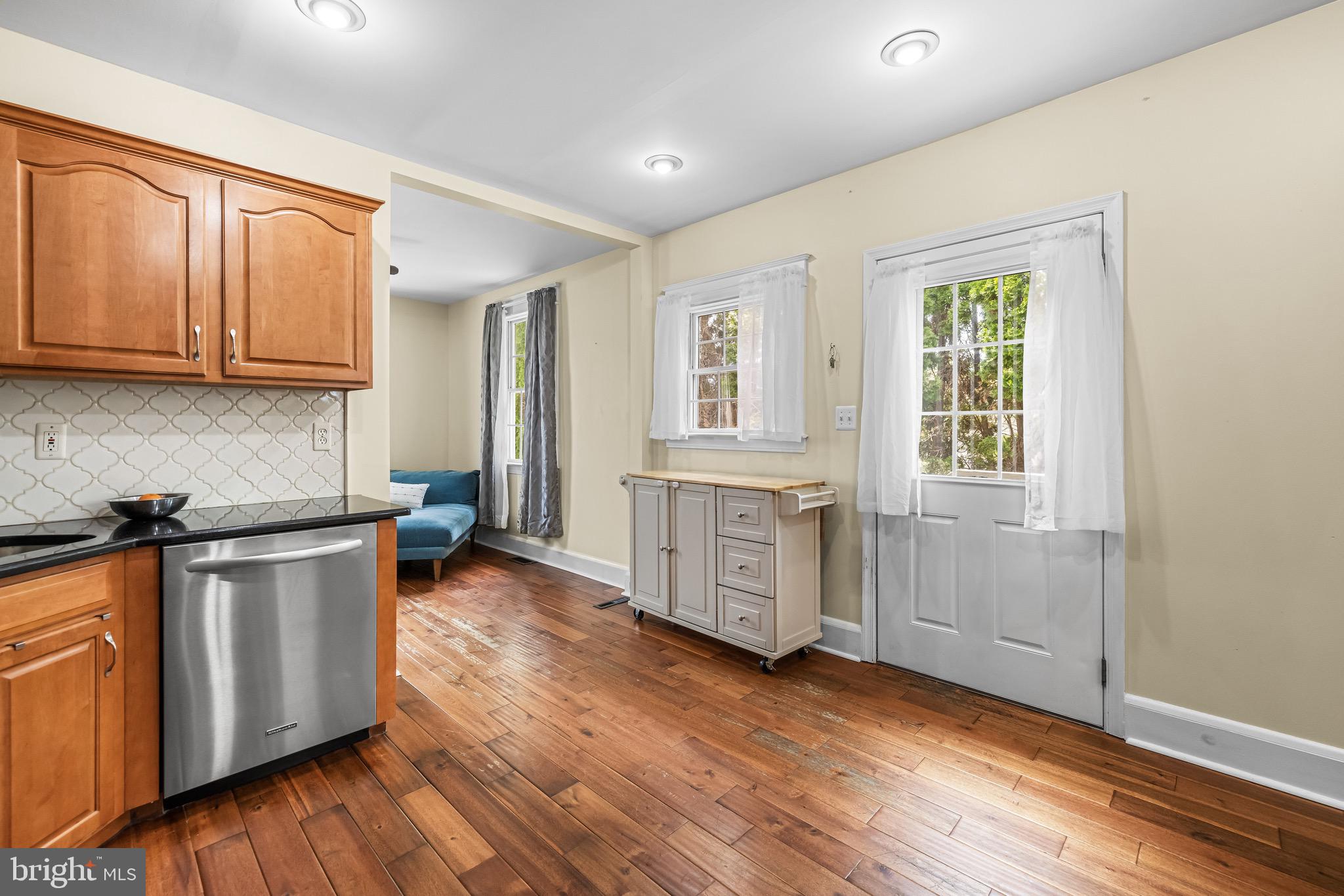 2913 Ritchie Avenue Baltimore, MD 21219 - Photo 10 of 34 an empty room with wooden floor and cabinets
