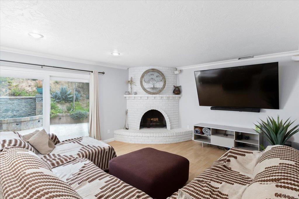 32460 Lilac Road Valley Center, CA 92082 - Photo 13 of 45 a living room with furniture and a flat screen tv